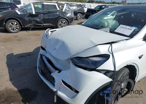 2023 Tesla Model Y Performance Dual Motor All-Wheel Drive z USA, uszkodzony, nr VIN 7SAYGDEF9PF665514